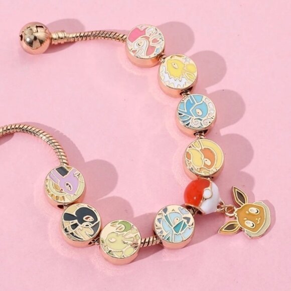 ⭐️NEW⭐️ Gold Plated & Enameled Pokémon Eevee Eeveelution Themed Charm Bracelet - Picture 4 of 8